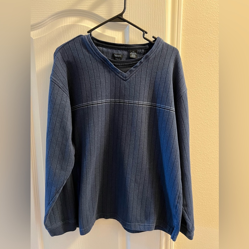 Blue sweater with white stripes across chest